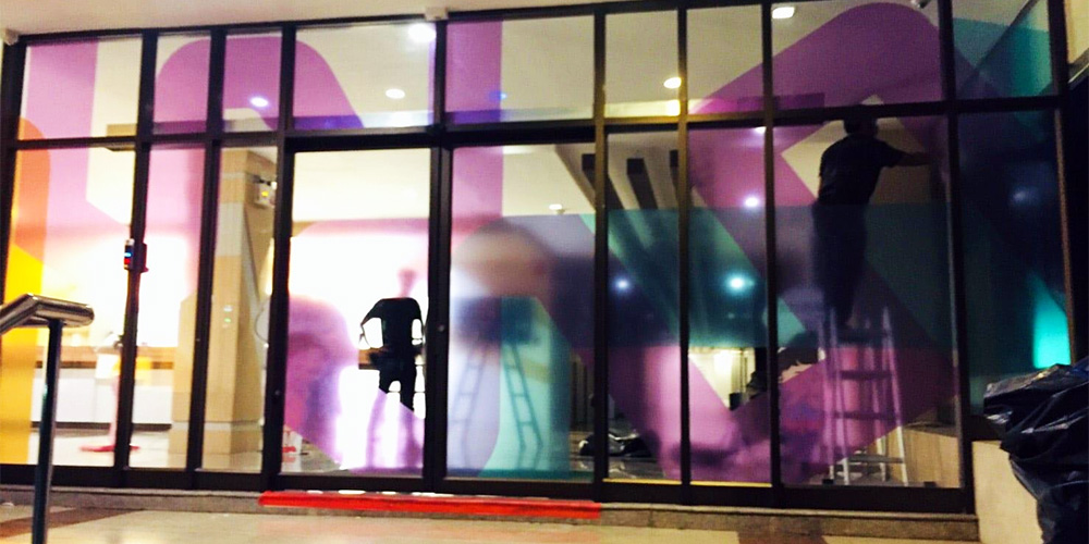 Finished retail storefront window graphics installation with clean professional result